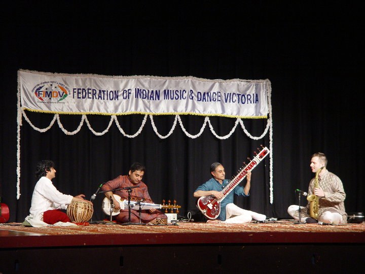 FIMDV stage performance with tabla, sarod, sitar and saxophone